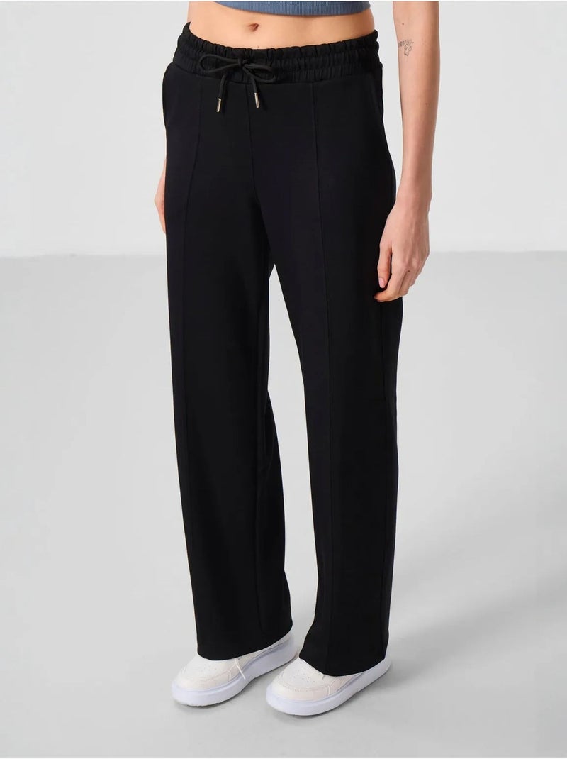 Pantaloni palazzo a gamba ampia testurizzati con vita con coulisse tommy Nero - Kiabi