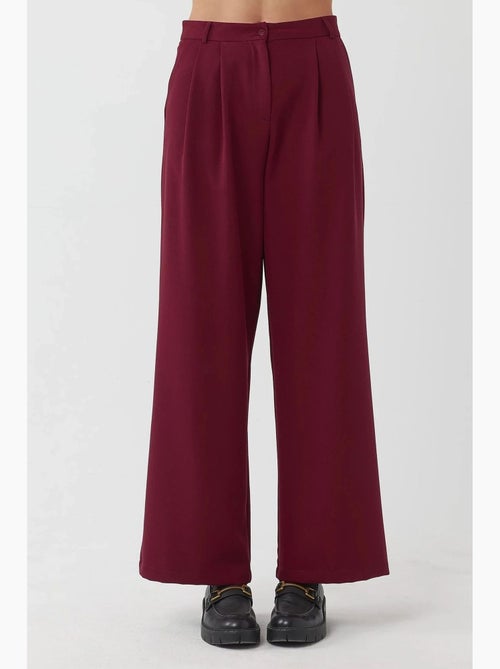 Pantaloni palazzo a vita alta con pieghe hiccup - Kiabi Pantaloni palazzo a vita alta con pieghe hiccup - Kiabi