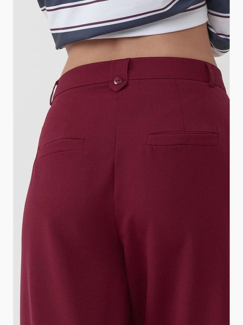 Pantaloni palazzo a vita alta con pieghe hiccup - Kiabi Pantaloni palazzo a vita alta con pieghe hiccup - Kiabi