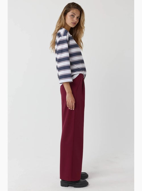 Pantaloni palazzo a vita alta con pieghe hiccup - Kiabi Pantaloni palazzo a vita alta con pieghe hiccup - Kiabi
