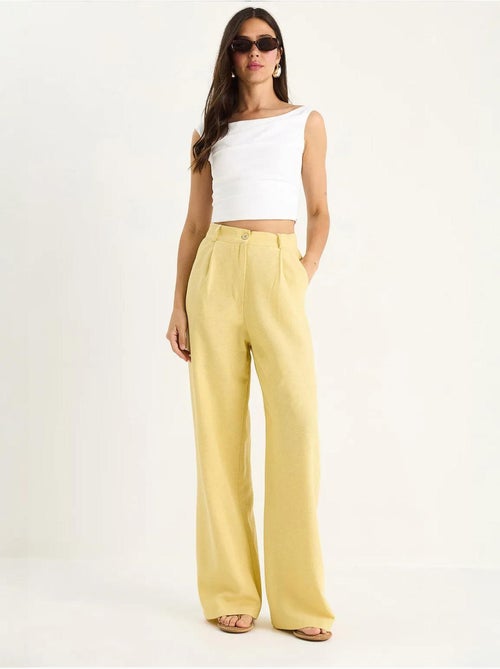 Pantaloni palazzo a vita alta con pieghe lucci - Kiabi Pantaloni palazzo a vita alta con pieghe lucci - Kiabi