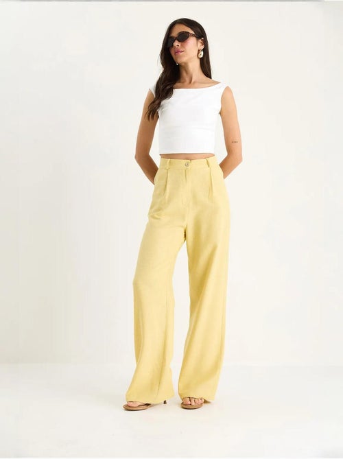 Pantaloni palazzo a vita alta con pieghe lucci - Kiabi Pantaloni palazzo a vita alta con pieghe lucci - Kiabi