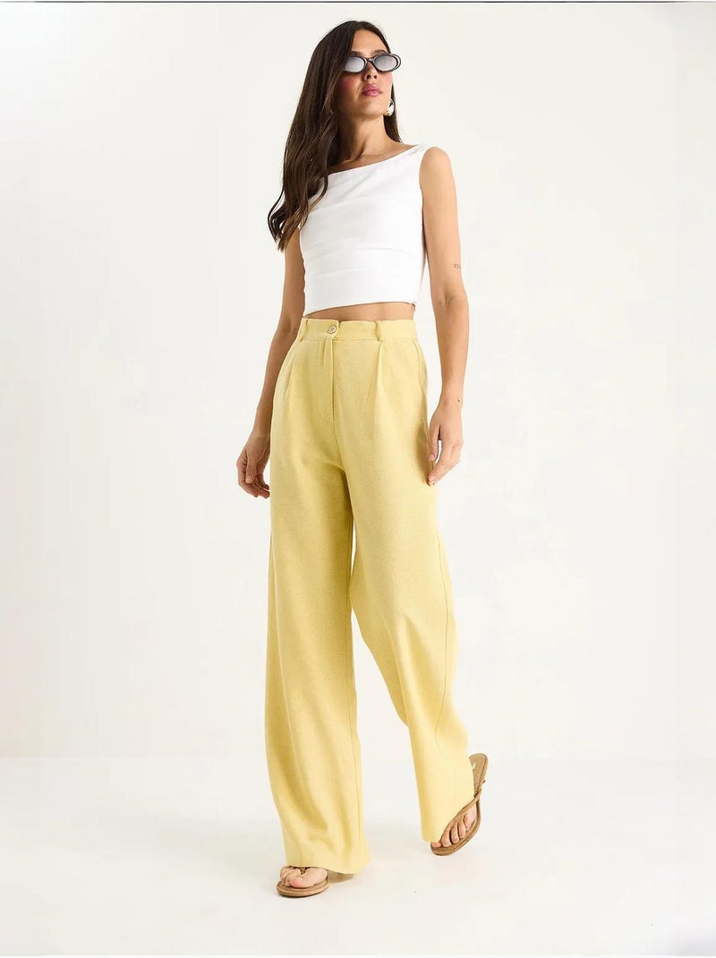 Pantaloni palazzo a vita alta con pieghe lucci Ambra - Kiabi