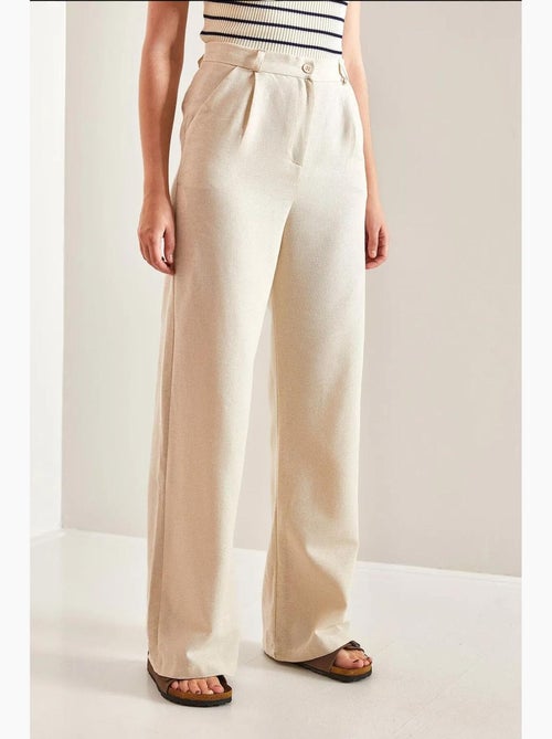 Pantaloni palazzo a vita alta con pieghe lucci - Kiabi Pantaloni palazzo a vita alta con pieghe lucci - Kiabi