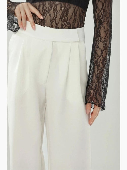 Pantaloni palazzo a vita alta e gamba ampia hiccup - Kiabi Pantaloni palazzo a vita alta e gamba ampia hiccup - Kiabi