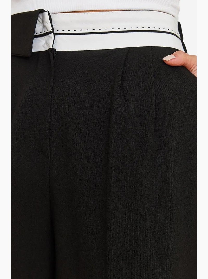 Pantaloni palazzo asimmetrici con vita a gamba larga e bottoni lucci Nero - Kiabi