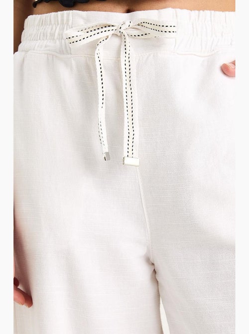 Pantaloni palazzo con vita elasticizzata lucci - Kiabi Pantaloni palazzo con vita elasticizzata lucci - Kiabi