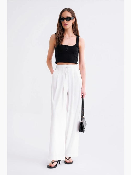 Pantaloni palazzo plissettati a vita alta mixray - Kiabi Pantaloni palazzo plissettati a vita alta mixray - Kiabi