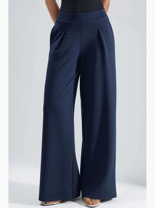 Pantaloni palazzo plissettati con vita elasticizzata busem - Kiabi Pantaloni palazzo plissettati con vita elasticizzata busem - Kiabi
