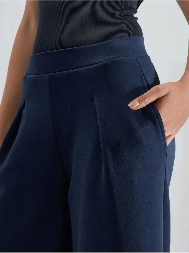 Pantaloni palazzo plissettati con vita elasticizzata busem Blu marino - Kiabi