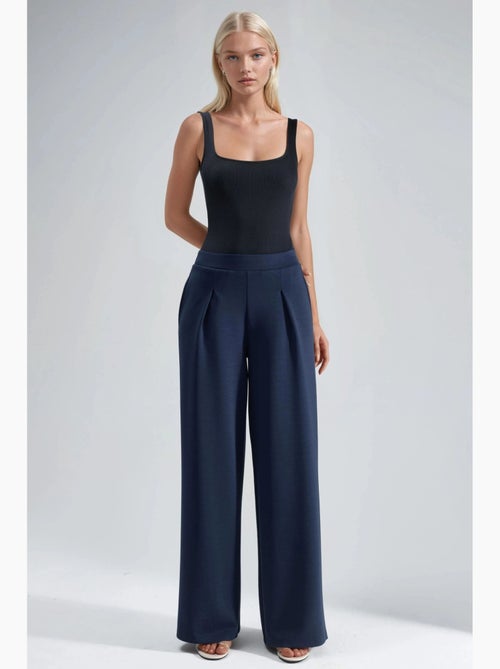 Pantaloni palazzo plissettati con vita elasticizzata busem - Kiabi Pantaloni palazzo plissettati con vita elasticizzata busem - Kiabi