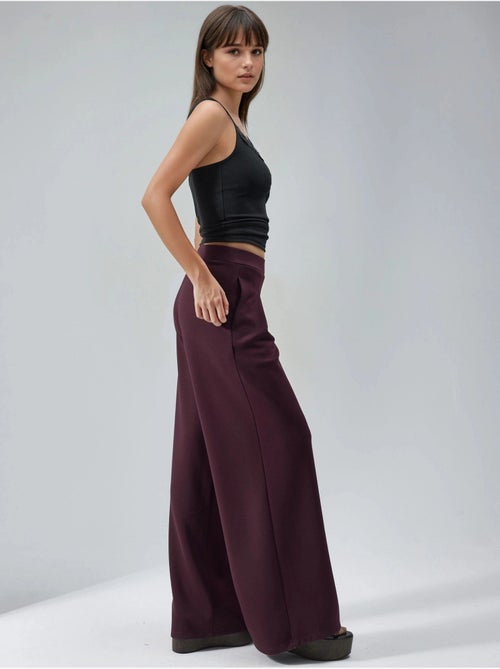 Pantaloni palazzo plissettati con vita elasticizzata busem - Kiabi Pantaloni palazzo plissettati con vita elasticizzata busem - Kiabi