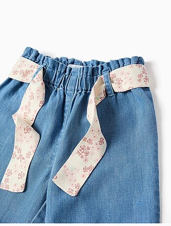 Pantaloni paperbag in denim con cintura floreale