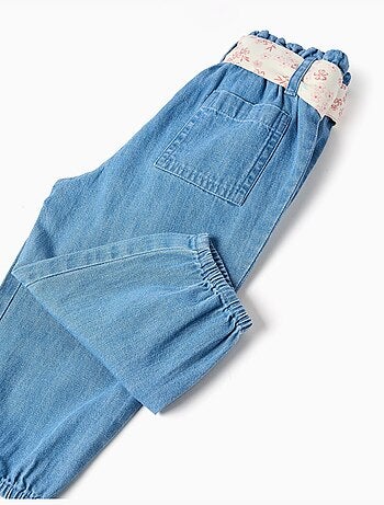 Pantaloni paperbag in denim con cintura floreale