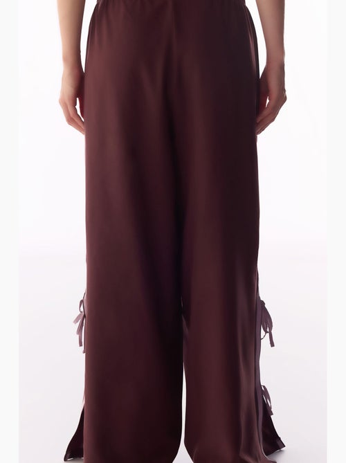 Pantaloni parachute a gamba larga con dettaglio fiocco penti - Kiabi Pantaloni parachute a gamba larga con dettaglio fiocco penti - Kiabi