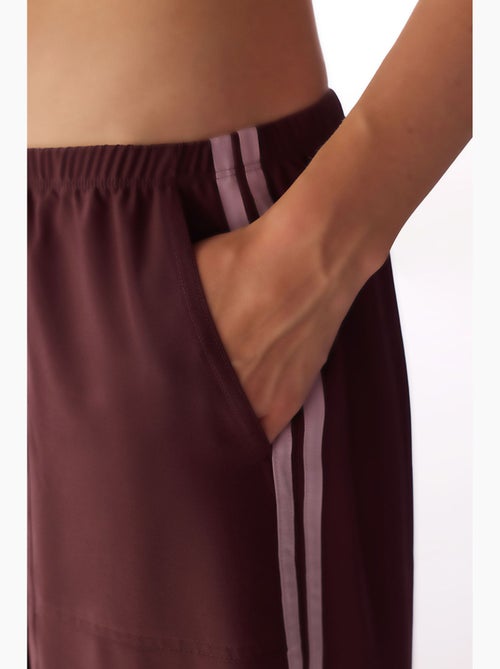 Pantaloni parachute a gamba larga con dettaglio fiocco penti - Kiabi Pantaloni parachute a gamba larga con dettaglio fiocco penti - Kiabi