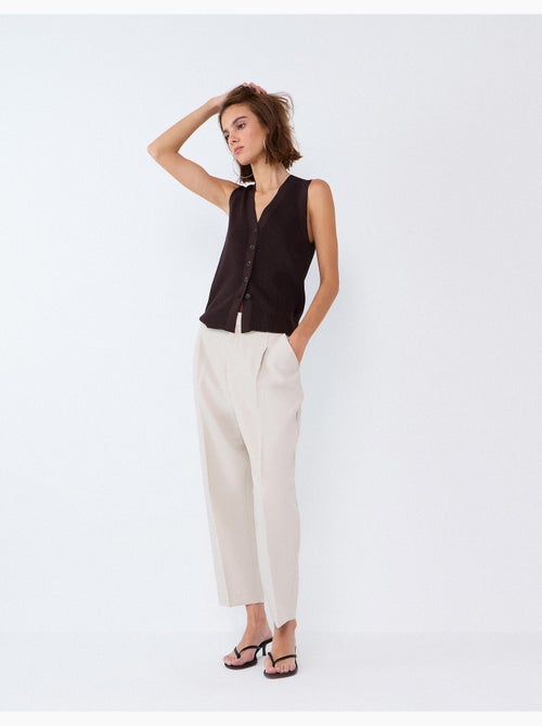 Pantaloni piegati, mo fashion - Kiabi Pantaloni piegati, mo fashion - Kiabi