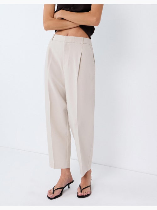 Pantaloni piegati, mo fashion - Kiabi Pantaloni piegati, mo fashion - Kiabi