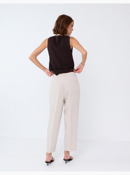 Pantaloni piegati, mo fashion - Kiabi Pantaloni piegati, mo fashion - Kiabi
