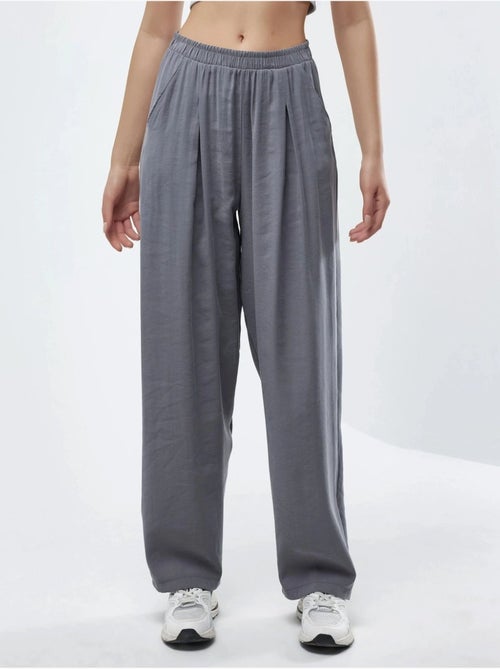 Pantaloni plissettati a gamba ampia busem - Kiabi Pantaloni plissettati a gamba ampia busem - Kiabi