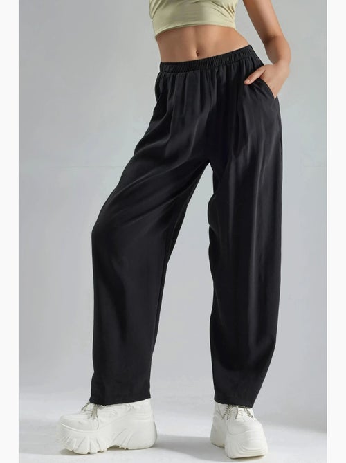 Pantaloni plissettati a gamba ampia busem - Kiabi Pantaloni plissettati a gamba ampia busem - Kiabi