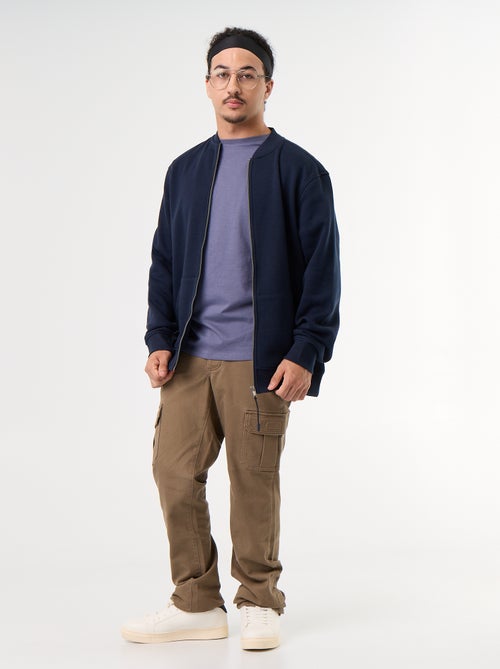 Pantaloni regular con tasche a patta - collezione facile da indossare - Kiabi Pantaloni regular con tasche a patta - collezione facile da indossare - Kiabi