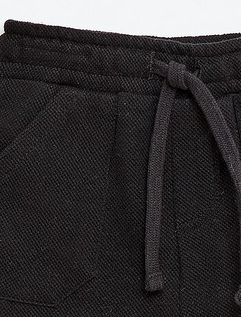 Pantaloni relax in maglia piqué