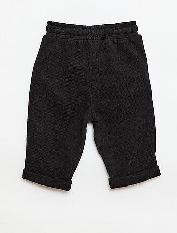 Pantaloni relax in maglia piqué