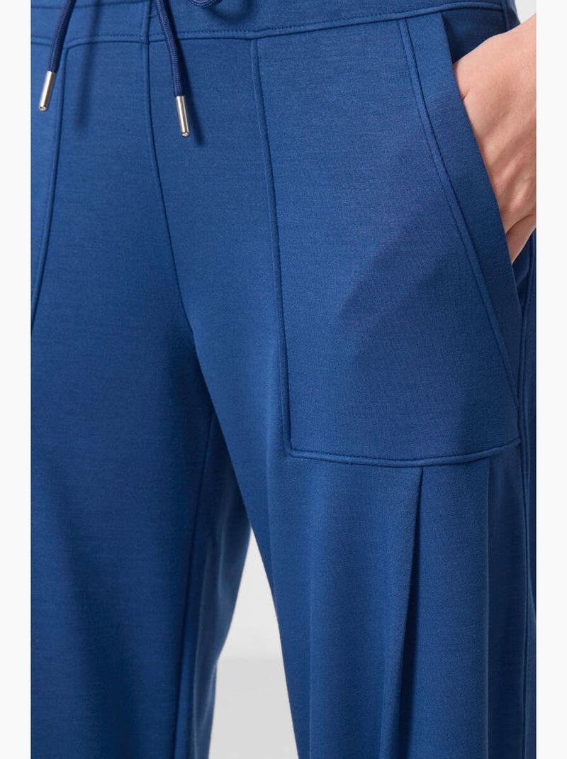 Pantaloni relaxed in crêpe a vita media con tasca tommy Blu - Kiabi