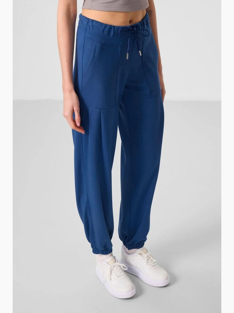 Pantaloni relaxed in crêpe a vita media con tasca tommy Blu - Kiabi