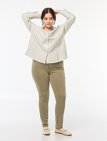 Pantaloni skinny a vita alta