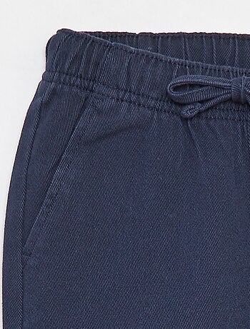 Pantaloni slim con vita regolabile