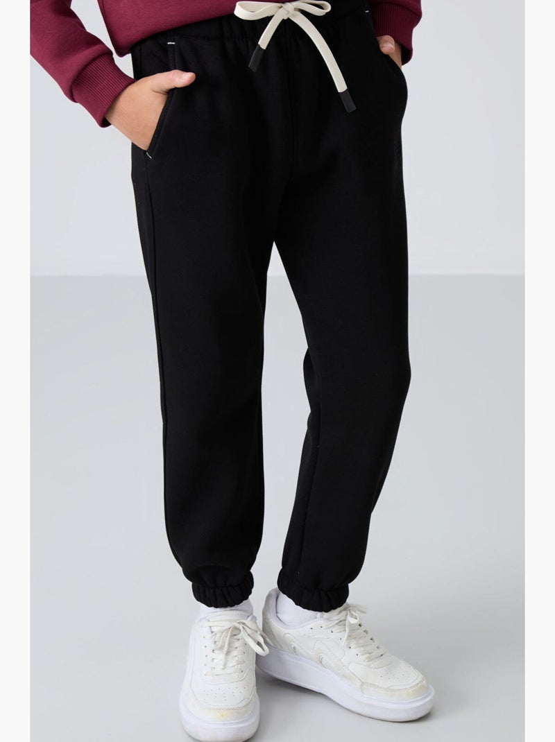 Pantaloni sport bambino tommy Nero Beige - Kiabi