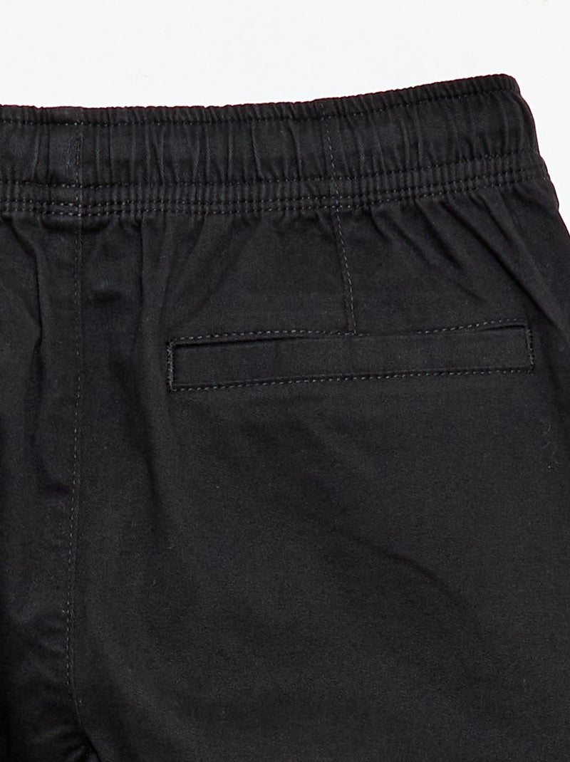 Pantaloni stretch tinta unita multitasche Nero - Kiabi