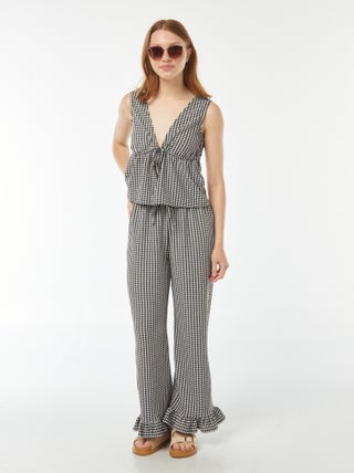 Pantaloni vichy con volant sul fondo