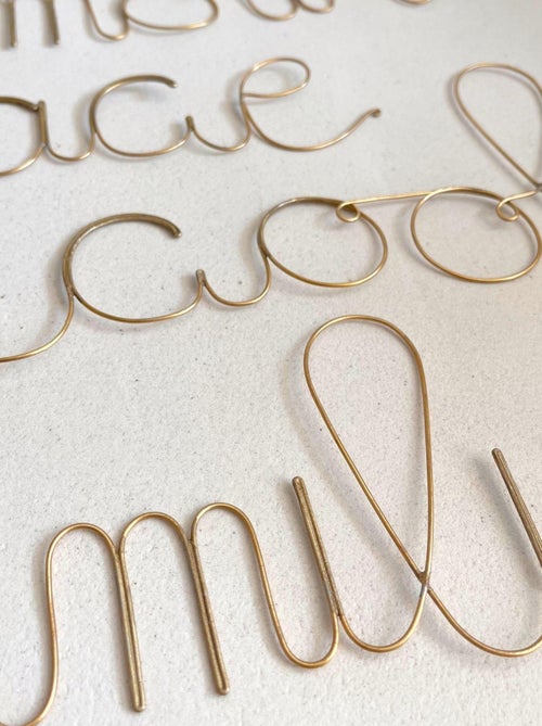 Parola in filo d'ottone dorato "FAMIGLIA - Kiabi