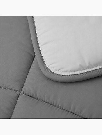 Piumino leggero bicolore reversibile in microfibra da 200 g/m²