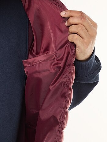 Piumino leggero smanicato con collo alto