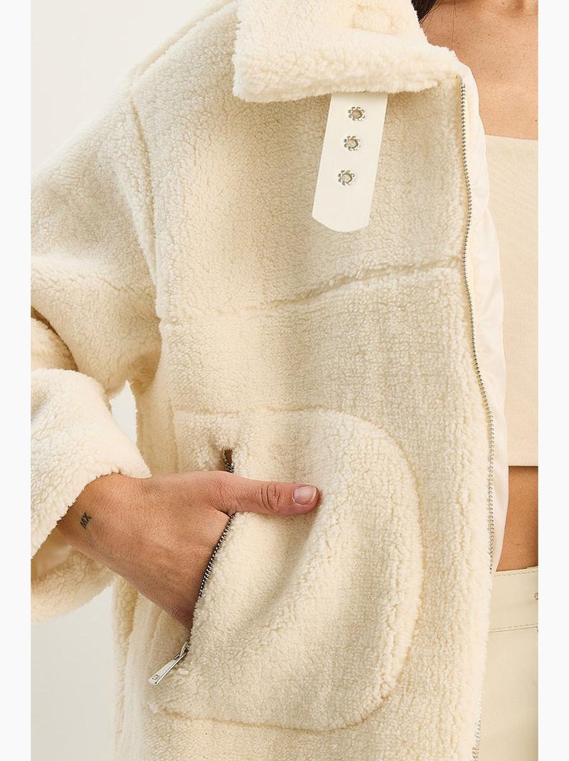 Piumino oversize in maglia peluche con chiusura a zip lucci Crema - Kiabi