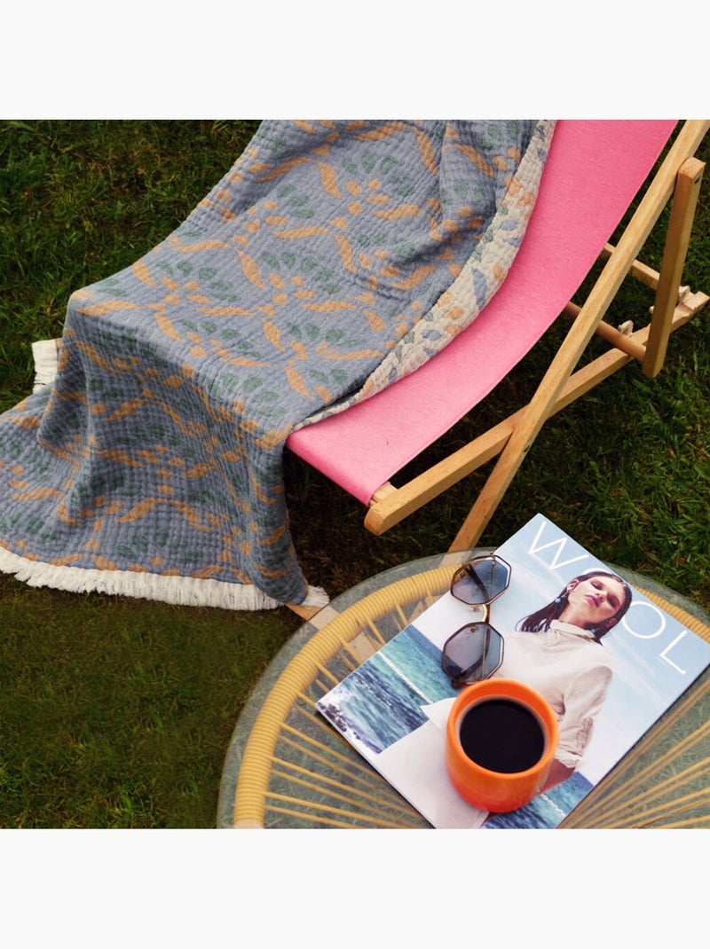 Plaid in garza di cotone lavato con motivo vegetale Verde salvia - Kiabi