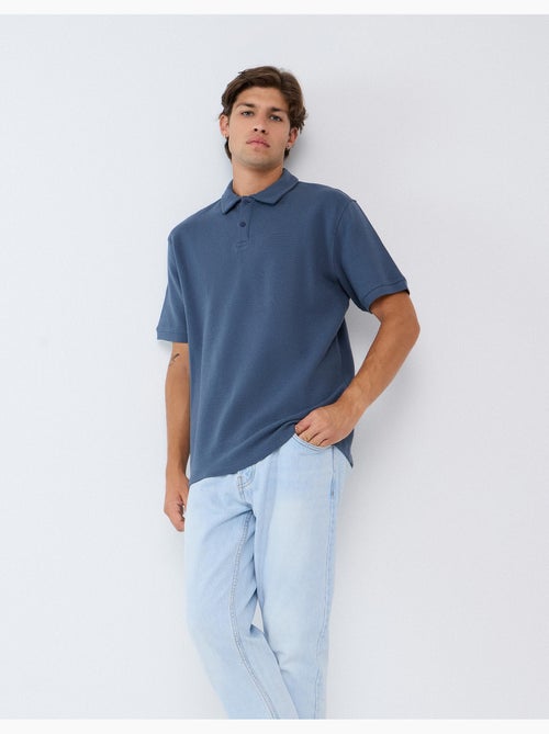 Polo a maglia texturizzata, mo fashion - Kiabi Polo a maglia texturizzata, mo fashion - Kiabi