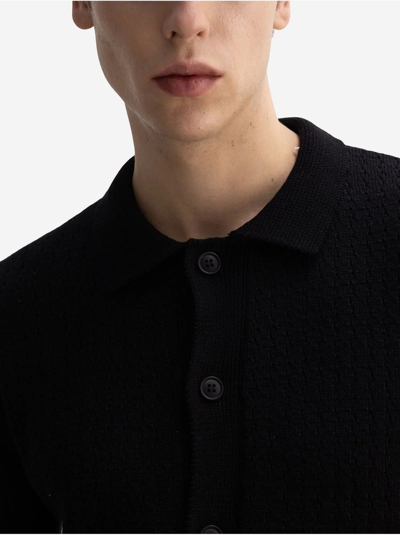 Polo a maniche corte in maglia testurizzata da uomo giesto Nero - Kiabi