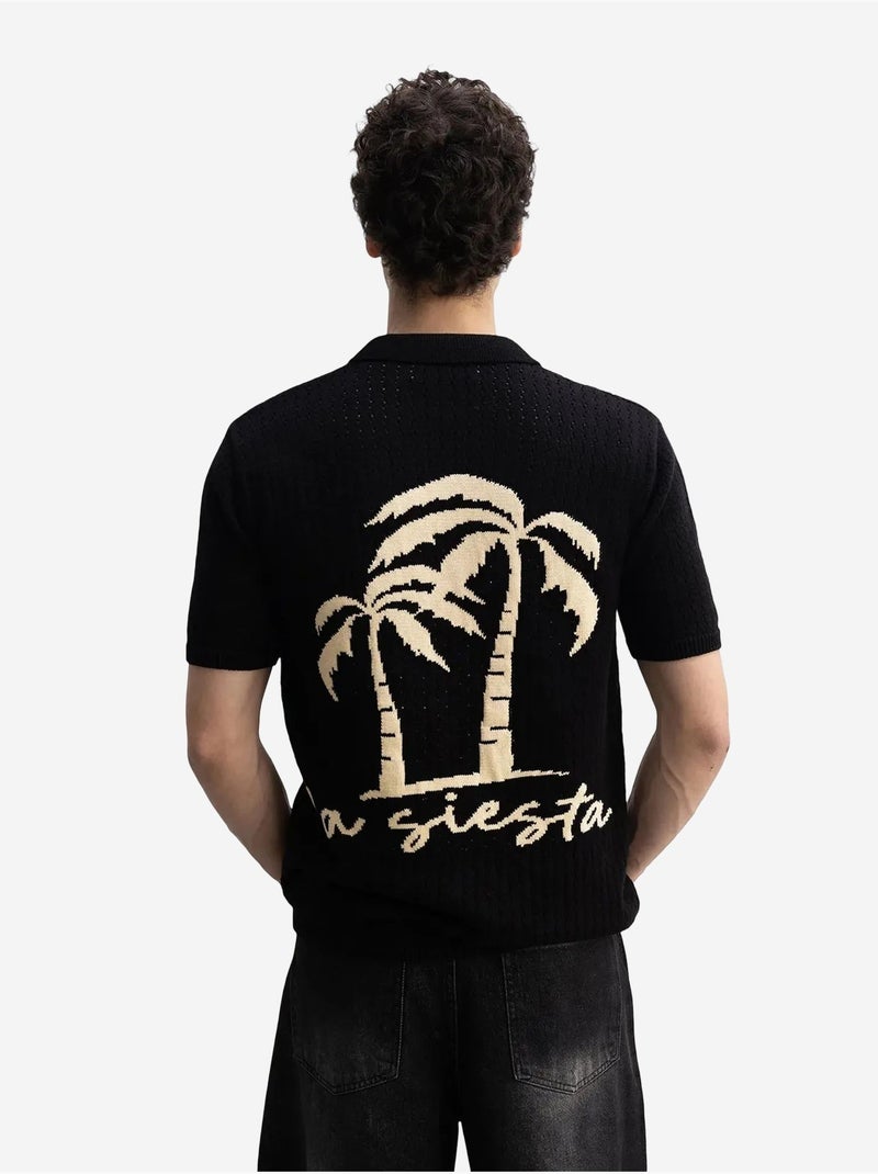 Polo a maniche corte in maglia testurizzata da uomo giesto Nero - Kiabi