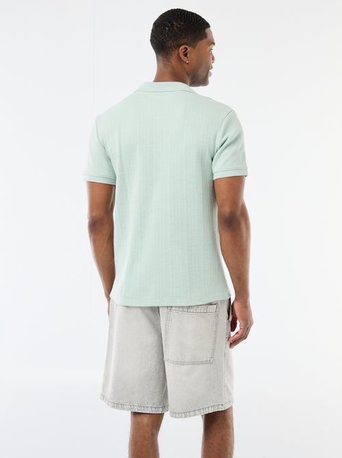 Polo a maniche corte in tessuto a nido d'ape - Kiabi Polo a maniche corte in tessuto a nido d'ape - Kiabi