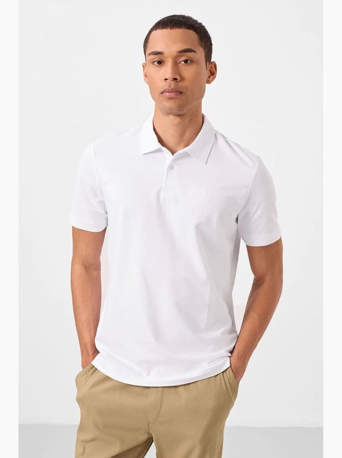Polo cotone elastan tommy - Kiabi Polo cotone elastan tommy - Kiabi