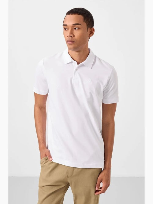Polo cotone elastan tommy - Kiabi Polo cotone elastan tommy - Kiabi