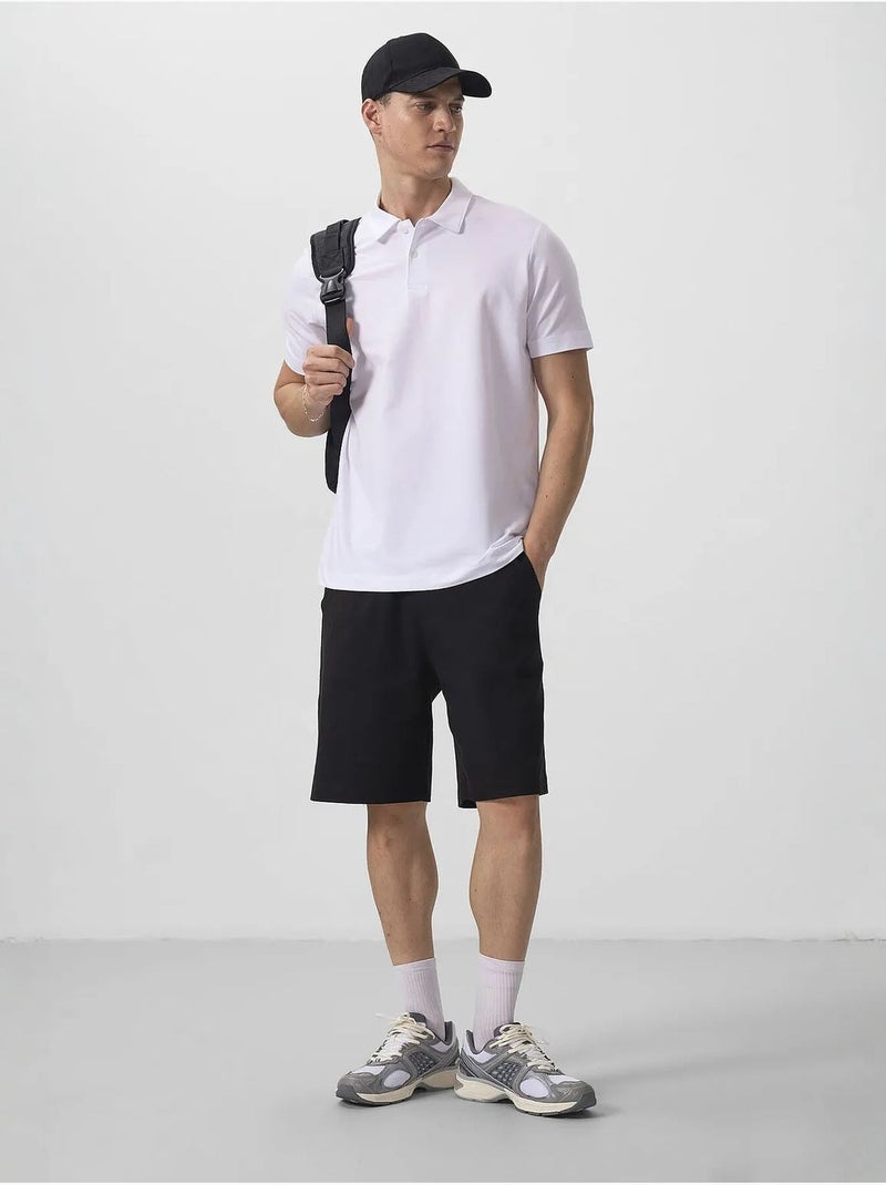Polo cotone elastan tommy Bianco - Kiabi