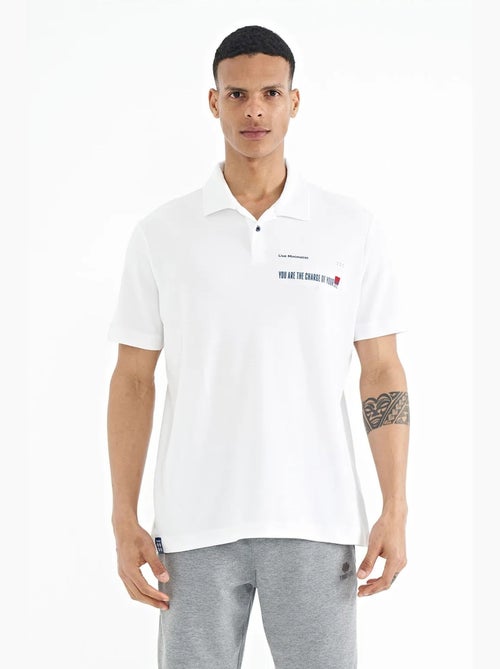 Polo cotone stampa testo tommy - Kiabi Polo cotone stampa testo tommy - Kiabi
