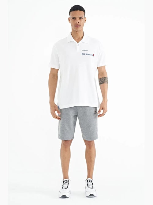 Polo cotone stampa testo tommy - Kiabi Polo cotone stampa testo tommy - Kiabi