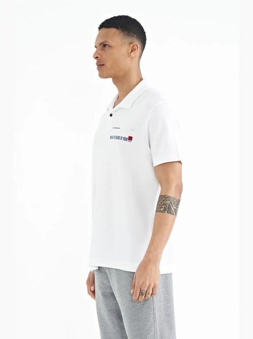 Polo cotone stampa testo tommy - Kiabi Polo cotone stampa testo tommy - Kiabi